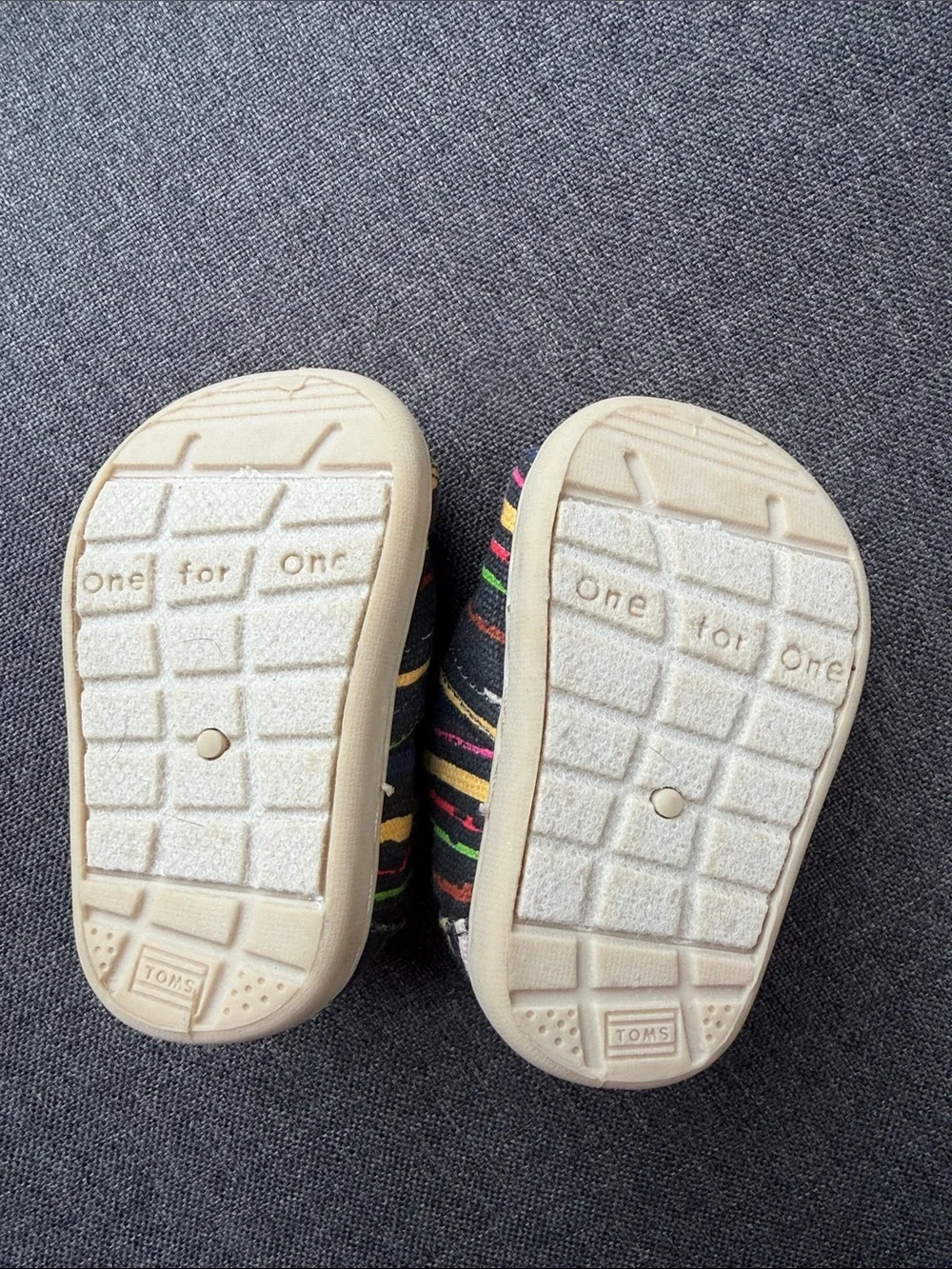 TOMS Baby Slip-On Shoes in Black with Multicolor Stripes